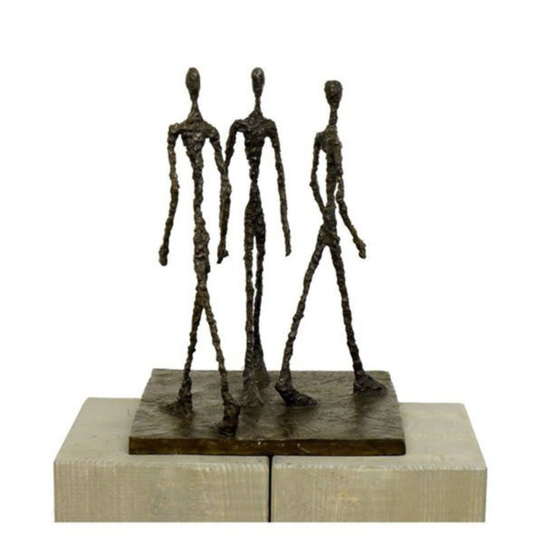 three men walking sculpture