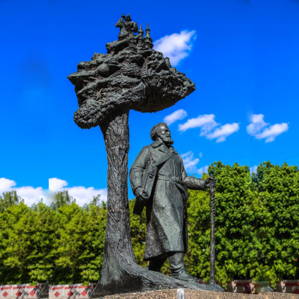 tree and man statue
