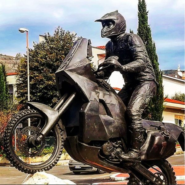 motorcycles and man statue