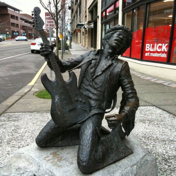 guitar and man statue
