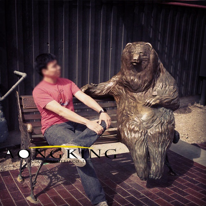 Bench statue of bear