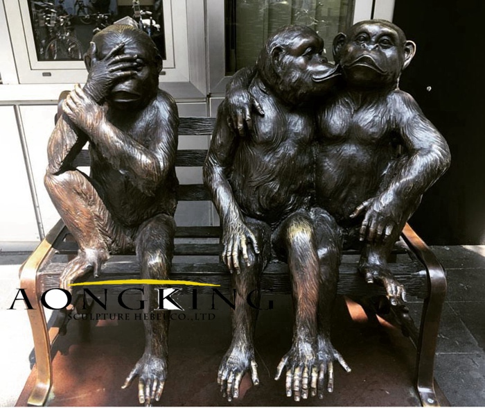 Three monkey statues