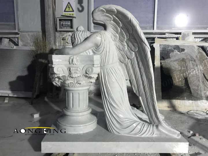 marble kneeling angel sculpture