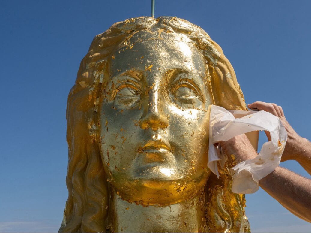 Covered with gold leaf virgin mary sculptures