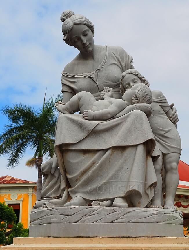 stone statue of mother and child
